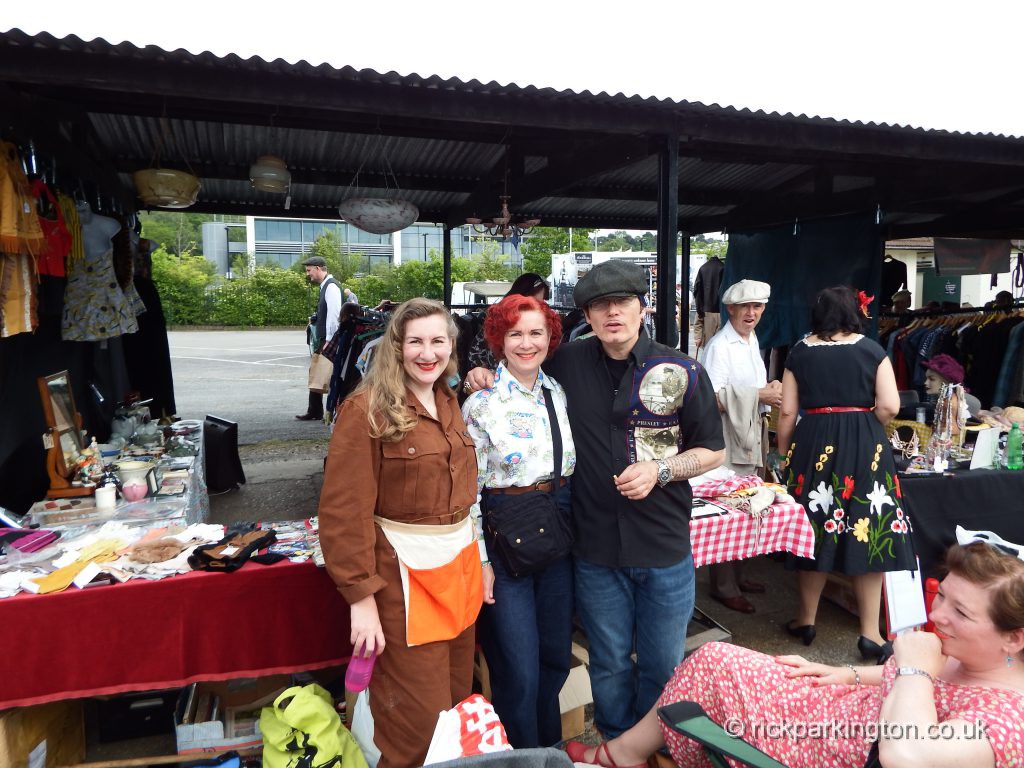 Adam Ant with the girls on the stall