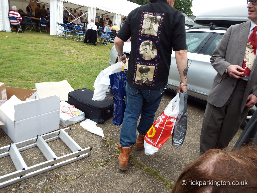 Adam leaving the stall laden with carrier bags